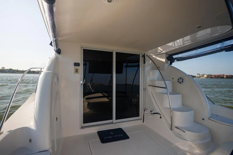 Slide: The Image of 2010 Meridian 391 Sedan yacht deck with stairs and sliding glass door. - 35