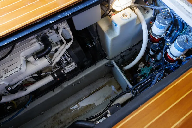 Slide: The Image of Engine compartment of a 2010 Meridian 391 Sedan, showcasing mechanical components and wiring. - 42