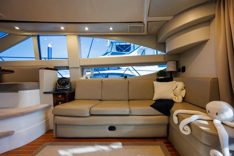 Slide: The Image of Luxurious interior of 2010 Meridian 391 Sedan yacht with plush seating and nautical decor. - 9