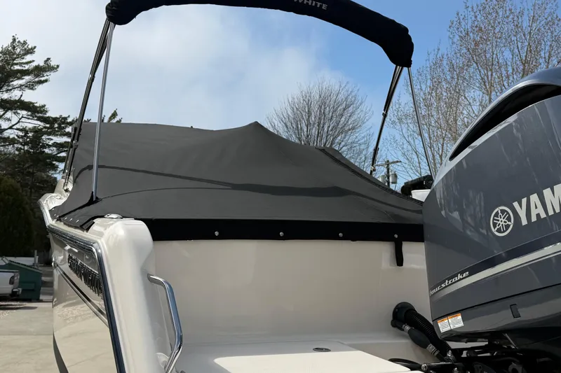 Slide: The Image of 2018 Grady-White Freedom 235 boat with Yamaha engine and protective cover. - 12