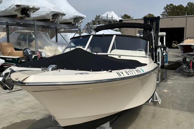 Slide: The Image of 2018 Grady-White Freedom 235 boat in storage, covered and ready for transport. - 13