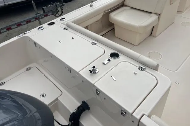 Slide: The Image of 2018 Grady-White Freedom 235 boat interior with seating and storage compartments. - 20