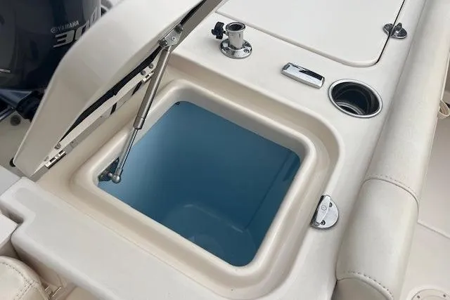Slide: The Image of Open storage compartment on 2018 Grady-White Freedom 235 boat deck. - 21