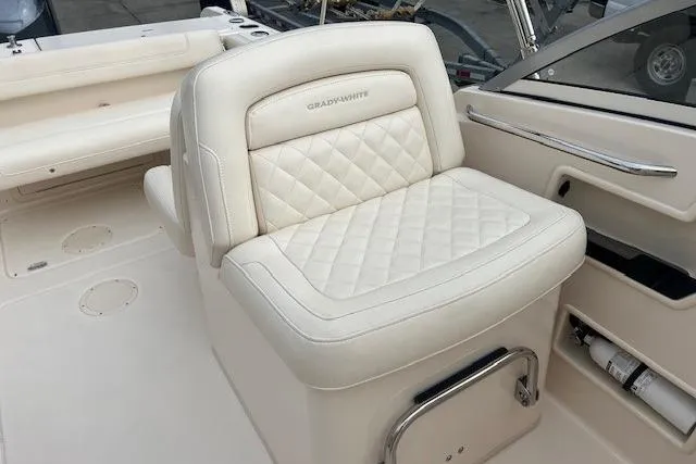 Slide: The Image of 2018 Grady-White Freedom 235 boat interior with luxurious white seating. - 29