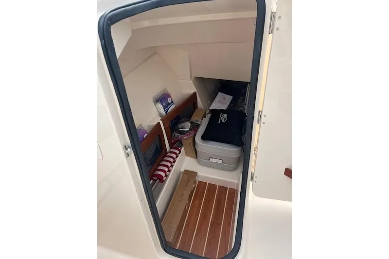 Slide: The Image of Interior cabin of 2018 Grady-White Freedom 235 boat with storage items. - 30