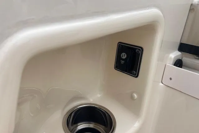 Slide: The Image of Cup holder and switch panel on 2018 Grady-White Freedom 235 boat. - 31