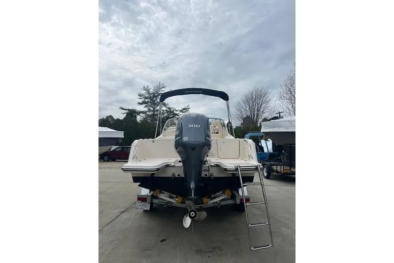 Slide: The Image of 2018 Grady-White Freedom 235 boat with Yamaha 300 outboard motor, parked outdoors. - 6