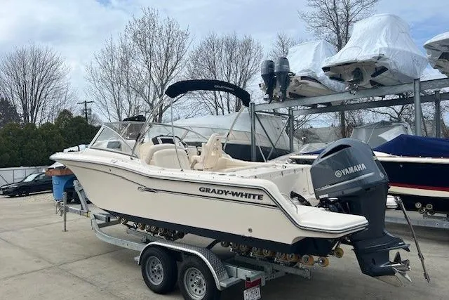 Slide: The Image of 2018 Grady-White Freedom 235 boat on trailer with Yamaha outboard motor. - 7
