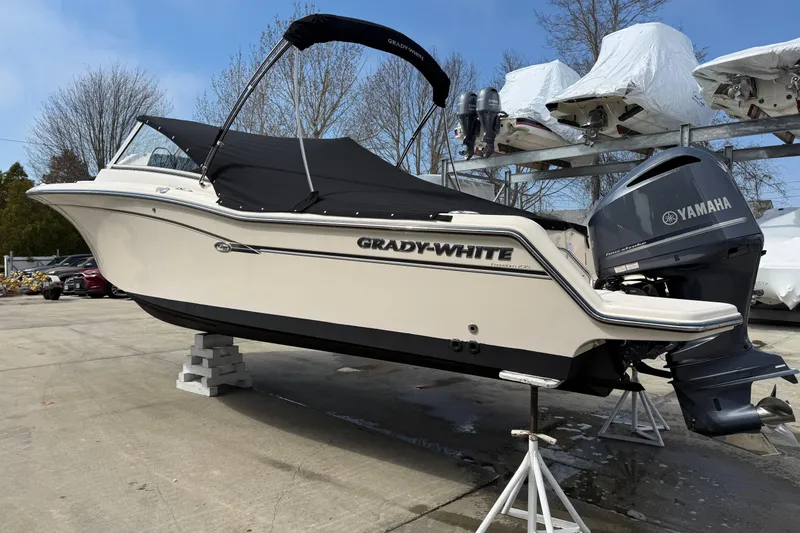 Slide: The Image of 2018 Grady-White Freedom 235 boat with Yamaha engine on display outdoors. - 8