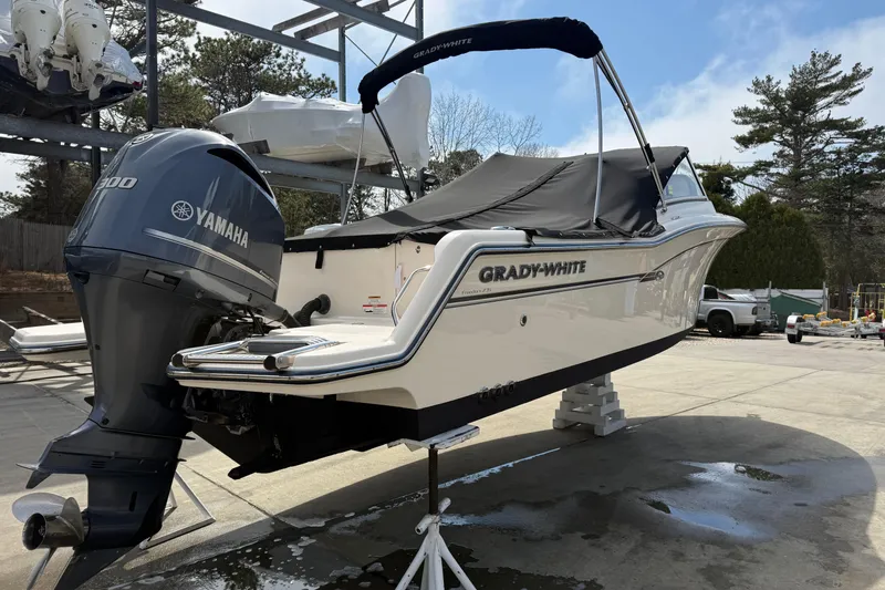 Slide: The Image of 2018 Grady-White Freedom 235 boat with Yamaha engine on display outdoors. - 9