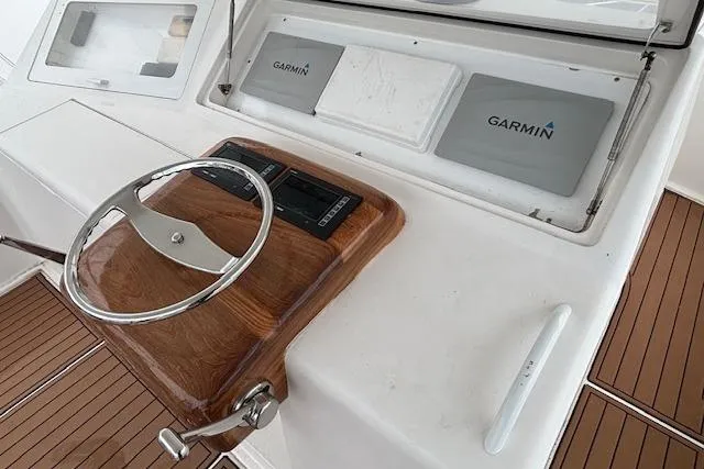 Slide: The Image of Steering console of 2007 Viking 52 Convertible yacht with Garmin navigation systems. - 13