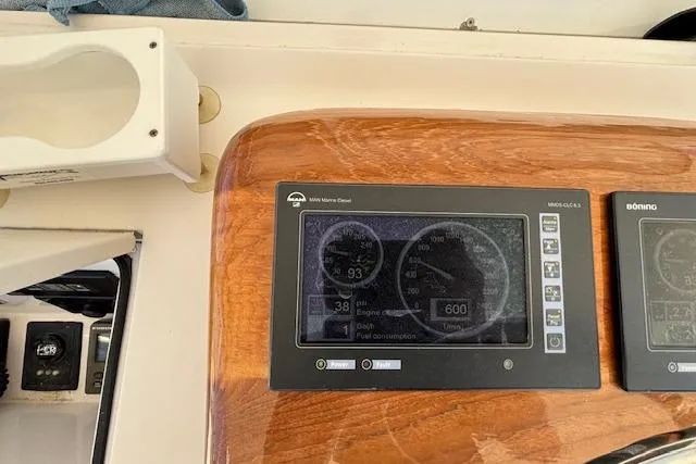 Slide: The Image of Dashboard of a 2007 Viking 52 Convertible boat with engine gauges and controls. - 14