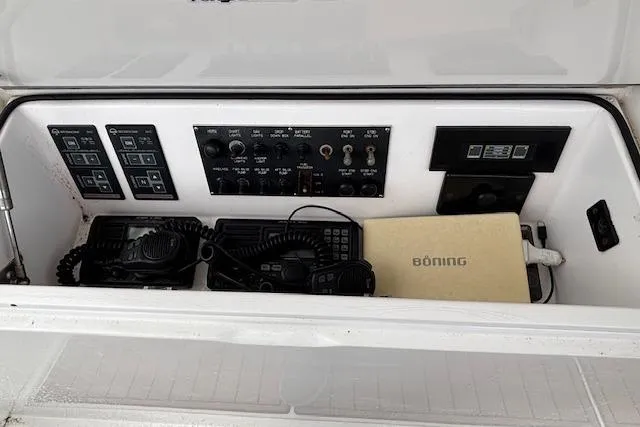 Slide: The Image of Control panel of a 2007 Viking 52 Convertible yacht with communication equipment. - 18