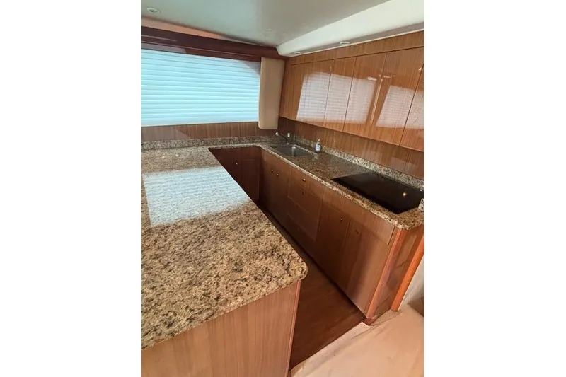 Slide: The Image of Luxurious kitchen interior of 2007 Viking 52 Convertible yacht with granite countertops. - 21