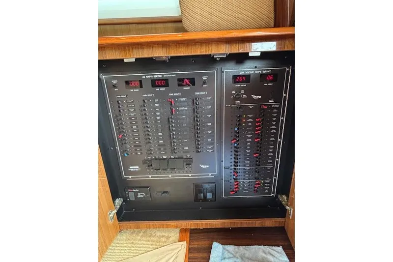 Slide: The Image of Electrical panel of a 2007 Viking 52 Convertible yacht, showcasing circuit breakers and controls. - 26