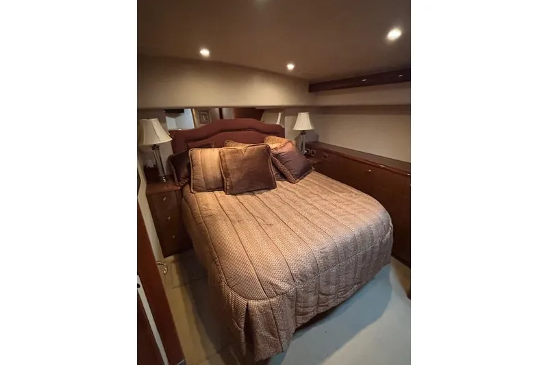 Slide: The Image of Luxurious bedroom interior of 2007 Viking 52 Convertible yacht with cozy bedding. - 28