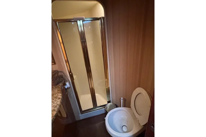 Slide: The Image of Bathroom interior of 2007 Viking 52 Convertible yacht with shower and toilet. - 30