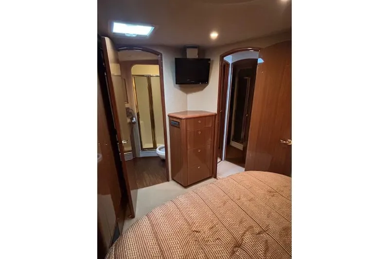 Slide: The Image of Interior of 2007 Viking 52 Convertible yacht with wood cabinetry and TV. - 31