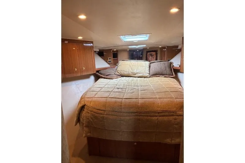 Slide: The Image of Luxurious cabin interior of 2007 Viking 52 Convertible yacht with cozy bedding. - 32