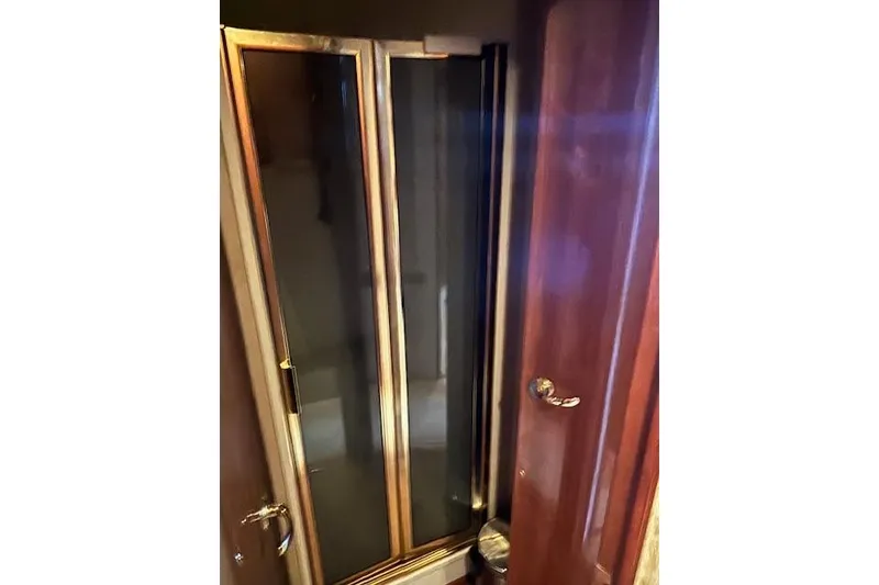 Slide: The Image of Wooden interior door on a 2007 Viking 52 Convertible yacht. - 34