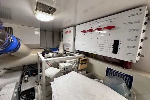 Slide: The Image of Engine room of a 2007 Viking 52 Convertible yacht with control panels and equipment. - 39