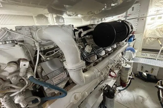Slide: The Image of Engine room of a 2007 Viking 52 Convertible yacht, showcasing detailed machinery components. - 41