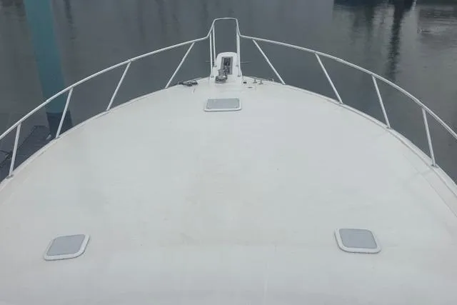 Slide: The Image of Bow view of 2007 Viking 52 Convertible yacht on calm water. - 7