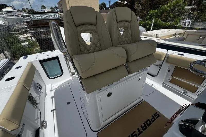 Slide: The Image of 2026 Sportsman Open 262 Center Console with dual beige captain seats. - 22