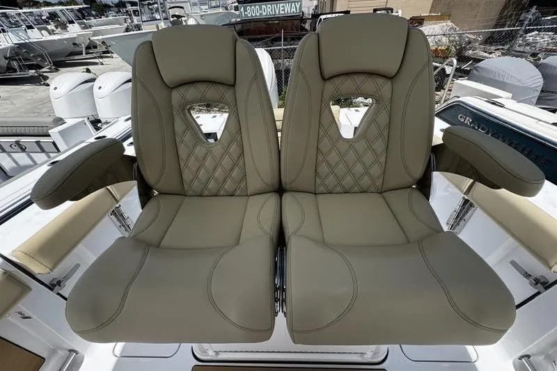 Slide: The Image of Luxurious seating on 2026 Sportsman Open 262 Center Console boat, featuring diamond-stitched upholstery. - 24