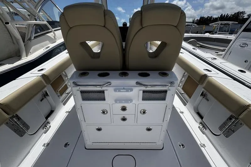 Slide: The Image of 2026 Sportsman Open 262 Center Console boat interior with dual seats and storage compartments. - 27