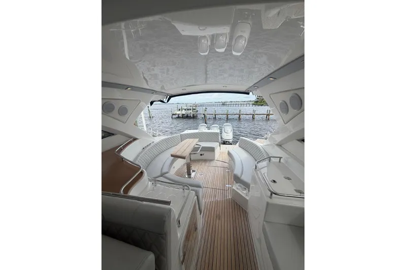 Slide: The Image of 2022 Schaefer 400 Sport yacht interior with elegant seating and wooden deck. - 11