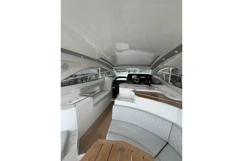 Slide: The Image of Interior of 2022 Schaefer 400 Sport yacht with elegant seating and modern dashboard. - 13