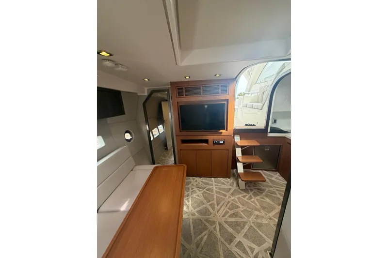 Slide: The Image of Luxurious interior of 2022 Schaefer 400 Sport yacht with modern furnishings and entertainment system. - 22