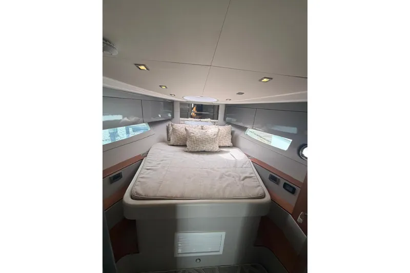 Slide: The Image of Luxurious interior cabin of 2022 Schaefer 400 Sport yacht with cozy bedding. - 24
