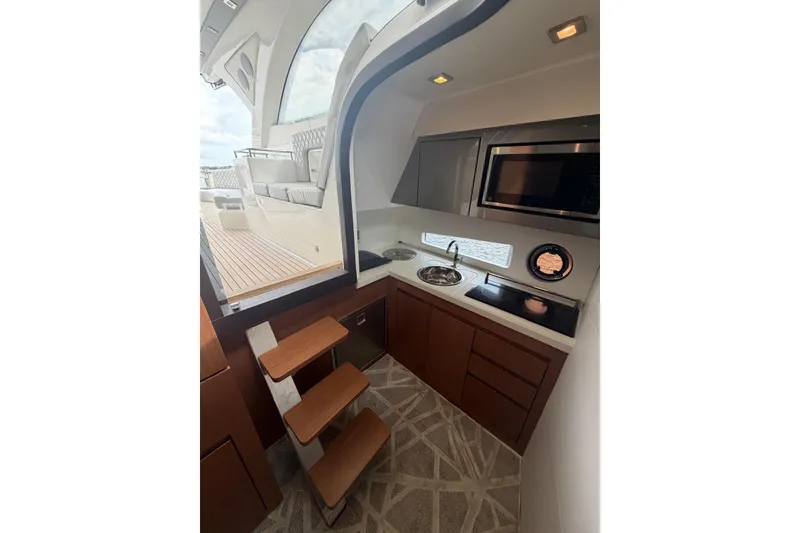 Slide: The Image of Luxurious 2022 Schaefer 400 Sport yacht interior with modern kitchen and sleek design. - 26