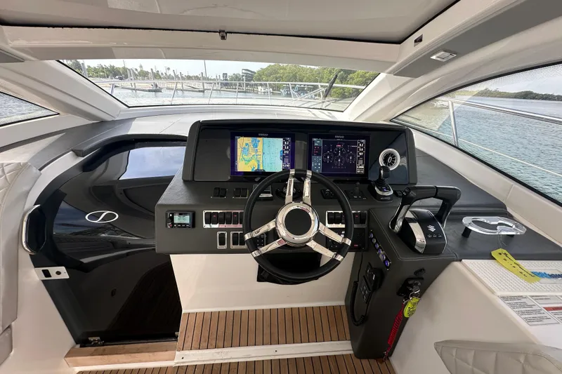 Slide: The Image of Cockpit of 2022 Schaefer 400 Sport yacht with modern navigation controls. - 3