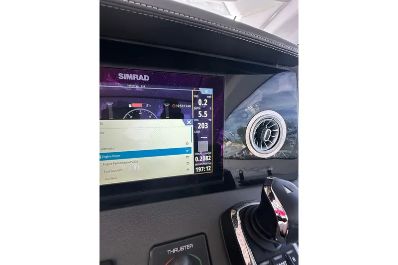 Slide: The Image of Dashboard of 2022 Schaefer 400 Sport with Simrad display and controls. - 4