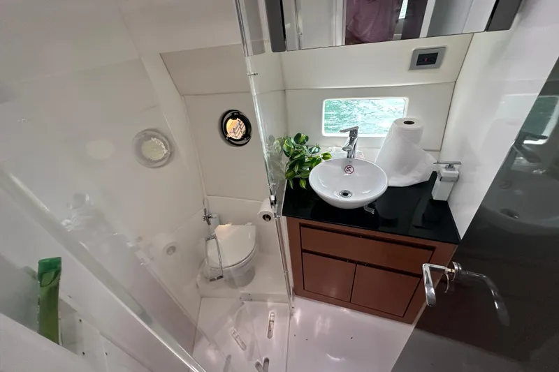 Slide: The Image of Luxurious bathroom interior of 2022 Schaefer 400 Sport yacht with modern fixtures. - 6