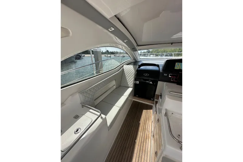 Slide: The Image of Interior of 2022 Schaefer 400 Sport yacht with elegant seating and modern dashboard. - 8