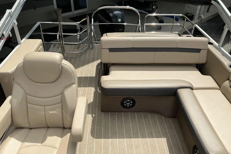 Slide: The Image of Interior of 2023 Godfrey Sweetwater 2286 SFL pontoon boat with beige seating and flooring. - 10