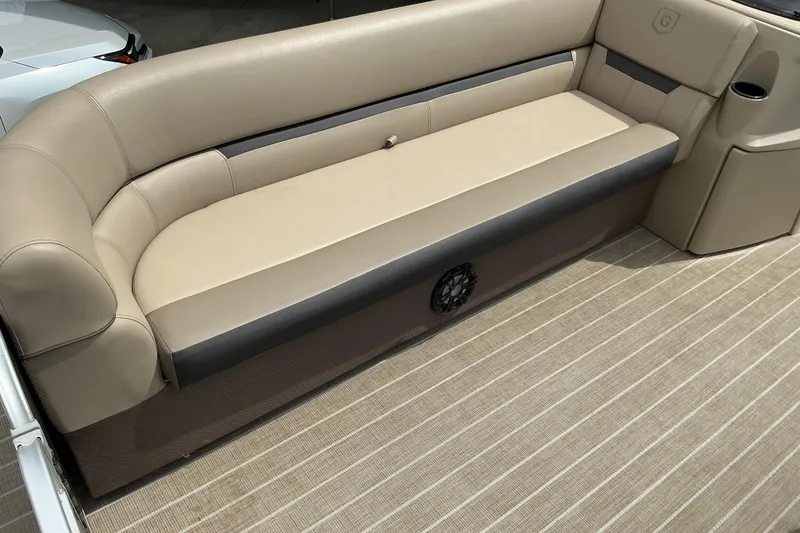 Slide: The Image of Beige seating on 2023 Godfrey Sweetwater 2286 SFL boat, featuring striped flooring. - 12