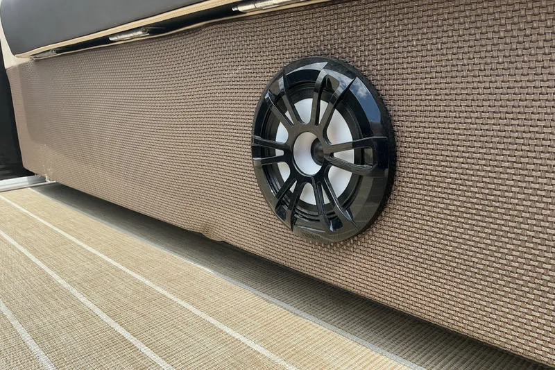 Slide: The Image of 2023 Godfrey Sweetwater 2286 SFL boat speaker on woven paneling. - 13