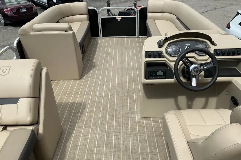 Slide: The Image of Interior of 2023 Godfrey Sweetwater 2286 SFL pontoon boat with beige seating and steering console. - 7