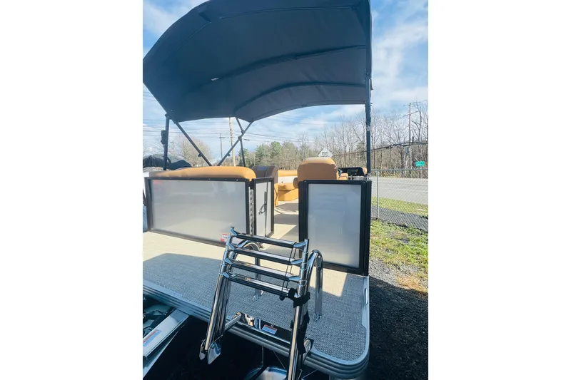 Slide: The Image of 2026 Crest Conquest SE 180 Cruise pontoon boat with canopy and boarding ladder. - 5