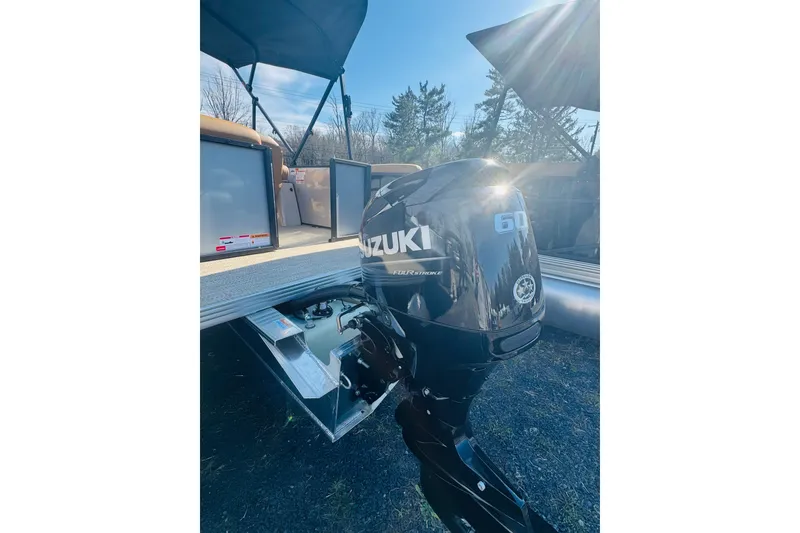 Slide: The Image of 2026 Crest Conquest SE 180 Cruise with Suzuki 60 outboard motor in sunlight. - 6