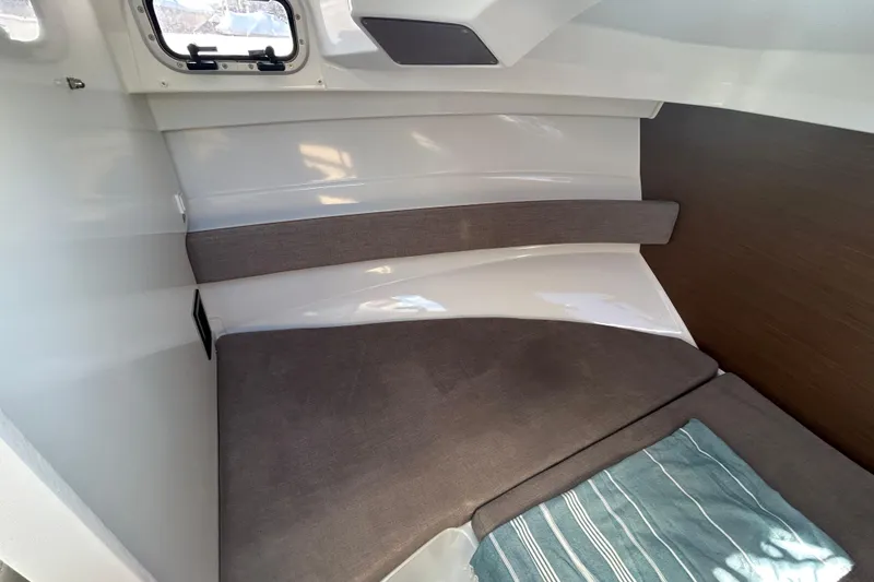 Slide: The Image of Interior cabin of 2021 Beneteau Antares 8 with cozy seating and window. - 12