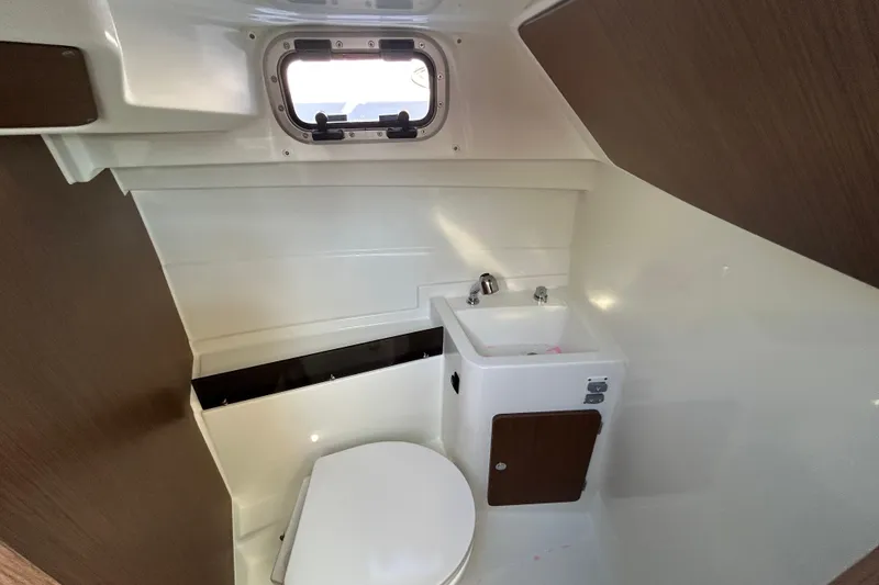 Slide: The Image of Interior of 2021 Beneteau Antares 8 boat bathroom with sink and toilet. - 15
