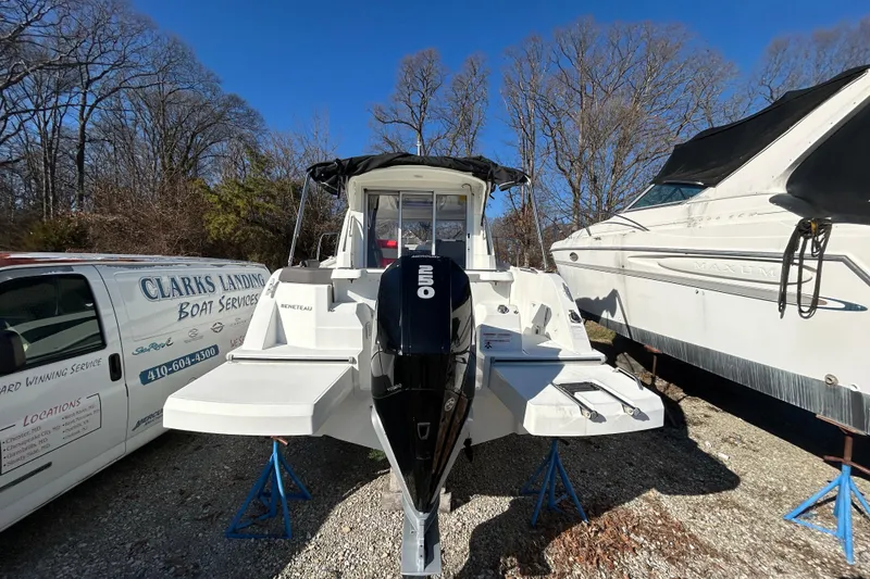 Slide: The Image of 2021 Beneteau Antares 8 boat with outboard motor, parked outdoors. - 3