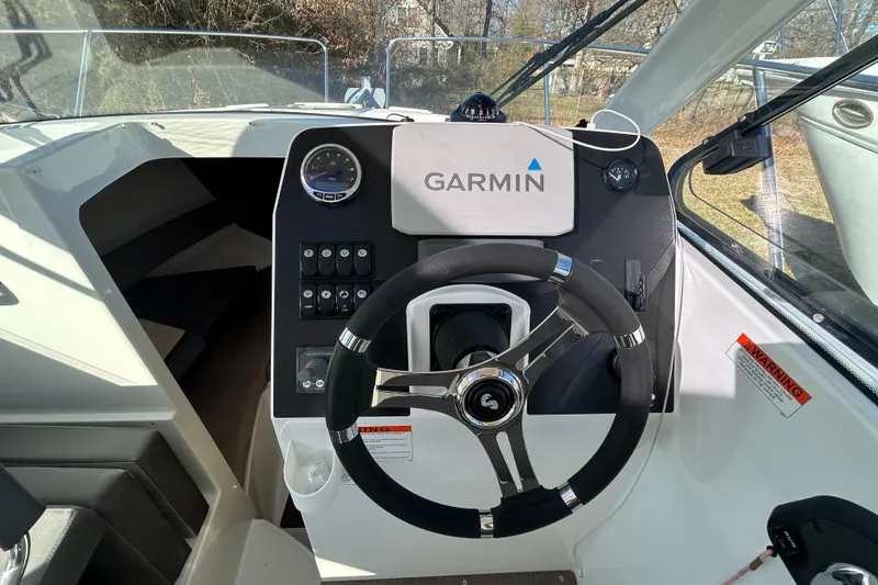 Slide: The Image of Steering console of a 2021 Beneteau Antares 8 with Garmin navigation system. - 6