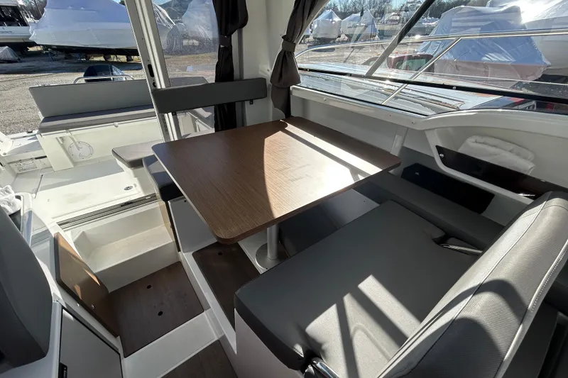 Slide: The Image of Interior of 2021 Beneteau Antares 8 boat with seating and table arrangement. - 8